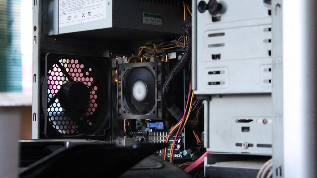 image of inside of desktop computer with fan as focal point