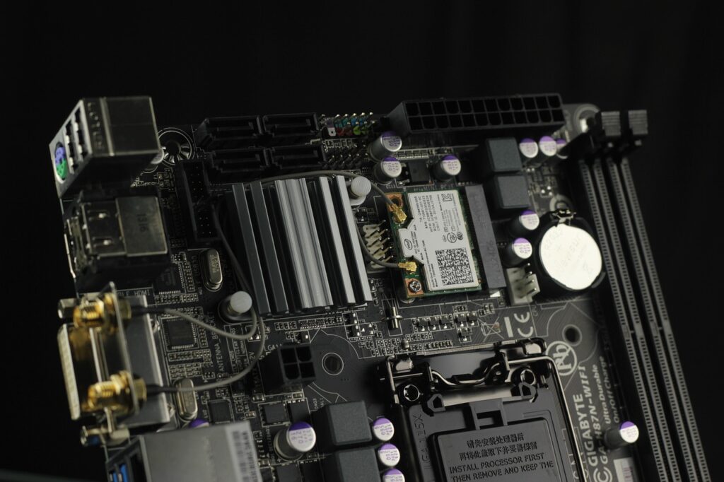 image of black motherboard with silver and copper colored accents